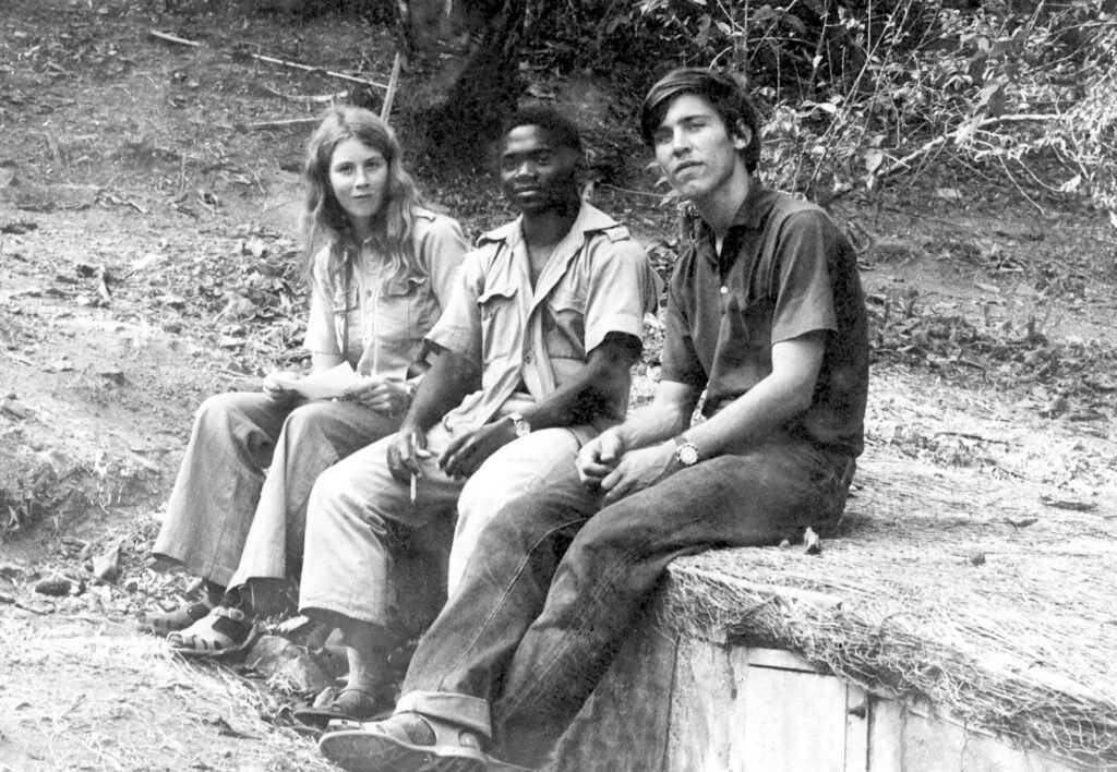 Six Chimpanzees Three Monkeys 1 Caroline Tutin, Yahaya Alamasi, and David C. Riss sit on the banana trench at Gombe in 1973.